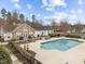 A high-angle shot of the neighborhood pool and clubhouse in a well-landscaped setting at 1146 Blue Bird Ln, Wake Forest, NC 27587