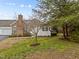 Charming home with brick chimney, white fence and fresh landscaping at 1146 Blue Bird Ln, Wake Forest, NC 27587