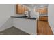 Kitchen with wooden cabinets, granite countertops, a breakfast bar, and stainless steel appliances at 1146 Blue Bird Ln, Wake Forest, NC 27587