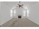 Spacious living room with a fireplace and lots of windows at 1146 Blue Bird Ln, Wake Forest, NC 27587