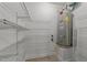 Utility room featuring ample wire shelving and a modern hot water tank at 1146 Blue Bird Ln, Wake Forest, NC 27587