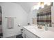 Well-lit bathroom featuring white vanity with single sink and modern fixtures at 1206 Linkwood Way, Fuquay Varina, NC 27526