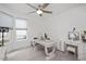 Bedroom featuring a modern desk setup, a ceiling fan, and lots of natural light at 1206 Linkwood Way, Fuquay Varina, NC 27526