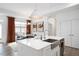 Bright kitchen featuring white countertops, a stainless steel sink, and modern lighting fixtures at 1206 Linkwood Way, Fuquay Varina, NC 27526