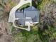 Aerial shot of a home's backyard with lush foliage, patio and backyard at 12101 Lockhart Ln, Raleigh, NC 27614
