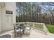 Cozy back deck with views of the lawn and trees, perfect for outdoor dining and relaxing at 12101 Lockhart Ln, Raleigh, NC 27614