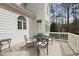 Relaxing back deck with table and chairs overlooking the lawn at 12101 Lockhart Ln, Raleigh, NC 27614