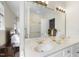 Bathroom with double sink vanity and an expansive mirror at 12101 Lockhart Ln, Raleigh, NC 27614