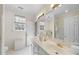 Bathroom with double vanity, tile floor, and a glass shower at 12101 Lockhart Ln, Raleigh, NC 27614