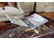 Interior design book on a glass coffee table at 12101 Lockhart Ln, Raleigh, NC 27614