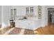 Dining area with white built-in cabinets, a small desk area, and hardwood floors at 12101 Lockhart Ln, Raleigh, NC 27614