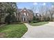 Beautiful brick home with lush landscaping and a private driveway at 12101 Lockhart Ln, Raleigh, NC 27614