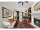 Inviting living room with fireplace, bookshelves, and views to adjacent rooms at 12101 Lockhart Ln, Raleigh, NC 27614