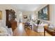 Comfortable living room with hardwood floors, sofa, and decorative cabinet creating a warm and inviting space at 12101 Lockhart Ln, Raleigh, NC 27614