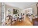 Bright, open-concept living room with hardwood floors, large windows, and a view into the adjacent dining area at 12101 Lockhart Ln, Raleigh, NC 27614
