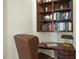 Office nook with wooden desk, leather chair and built in bookshelves at 12101 Lockhart Ln, Raleigh, NC 27614