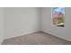 Cozy bedroom featuring neutral carpet and a window with a treeline view at 127 N Keatts Winner Ct, Wilson's Mills, NC 27520