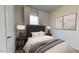 Serene bedroom with a plush bed, decorative lamps, and stylish artwork at 127 N Keatts Winner Ct, Wilson's Mills, NC 27520