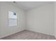 Small bedroom with neutral carpet and window at 127 N Keatts Winner Ct, Wilson's Mills, NC 27520