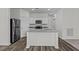 Modern kitchen with a large island, stainless steel appliances, and ample counter space at 127 N Keatts Winner Ct, Wilson's Mills, NC 27520