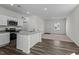 Open kitchen with granite countertops, stainless steel appliances, and access to the living area at 127 N Keatts Winner Ct, Wilson's Mills, NC 27520