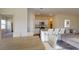 Open-concept kitchen with a center island, granite countertops, stainless steel appliances, and ample cabinet space at 127 N Keatts Winner Ct, Wilson's Mills, NC 27520