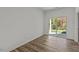 A room with wood floors and a sliding glass door leading to the backyard at 127 N Keatts Winner Ct, Wilson's Mills, NC 27520