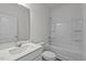 Bathroom featuring a single sink vanity with a white countertop and a shower-tub combination at 135 N Keatts Winner Ct, Clayton, NC 27520