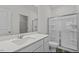 Bright bathroom with a large vanity and a glass enclosed shower at 135 N Keatts Winner Ct, Clayton, NC 27520