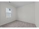 An empty bedroom with carpet flooring and a window with blinds at 135 N Keatts Winner Ct, Clayton, NC 27520