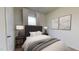Furnished bedroom with a gray headboard, neutral paint, and carpet flooring at 135 N Keatts Winner Ct, Clayton, NC 27520