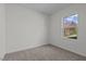 An empty bedroom with carpet flooring and natural light at 135 N Keatts Winner Ct, Clayton, NC 27520