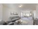Stylish living room area with modern furniture, a decorative rug, and an open layout connecting to the kitchen at 135 N Keatts Winner Ct, Clayton, NC 27520