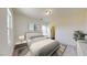 Furnished bedroom with gray decor, carpet flooring, and a view to the bathroom at 135 N Keatts Winner Ct, Clayton, NC 27520