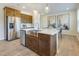 Modern kitchen features stainless steel appliances, ample counter space, and a stylish center island with sink at 1485 Hasse Ave, Apex, NC 27502