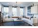 Stylish living room with large windows, comfortable sectional sofa, and chic decor offers relaxation at 1485 Hasse Ave, Apex, NC 27502