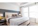 Bright main bedroom features a large bed, decorative wall accents, and ample natural light at 1485 Hasse Ave, Apex, NC 27502
