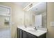 The bathroom features a double vanity with a large mirror, and modern lighting, freshly painted at 1536 Ricochet Dr, Raleigh, NC 27610