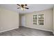 Bedroom featuring neutral paint, a bright window view, and new wood flooring at 1536 Ricochet Dr, Raleigh, NC 27610