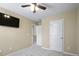 Bedroom features ceiling fan and neutral walls with carpeted floors at 1536 Ricochet Dr, Raleigh, NC 27610