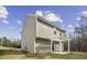 Exterior view of home featuring back patio and green yard at 1536 Ricochet Dr, Raleigh, NC 27610