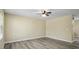 Spacious living room featuring neutral paint, ample lighting, and new wood flooring at 1536 Ricochet Dr, Raleigh, NC 27610