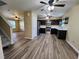 Open concept living area featuring new wood flooring and stainless steel appliances at 1536 Ricochet Dr, Raleigh, NC 27610