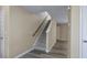 A well-lit stairway leads to the next level with neutral tones and durable floors at 1536 Ricochet Dr, Raleigh, NC 27610