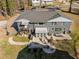 A sprawling backyard with a patio, fire pit, dining area, and lush landscaping for outdoor enjoyment at 1603 N Alston Ave, Durham, NC 27701
