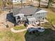 Aerial view of a home's large backyard with a patio, fire pit, and dining area at 1603 N Alston Ave, Durham, NC 27701