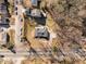 Overhead shot of a home with a dark roof, patio, and surrounding neighborhood; a peaceful residential setting at 1603 N Alston Ave, Durham, NC 27701
