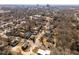 A captivating aerial view showcases homes in a residential neighborhood with the city skyline visible in the distance at 1603 N Alston Ave, Durham, NC 27701
