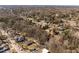 A peaceful aerial view presents a neighborhood with mature trees, showcasing community charm and a desirable residential location at 1603 N Alston Ave, Durham, NC 27701
