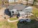 Aerial view of home showcasing an outdoor patio with lounge seating, dining area, and basketball court at 1603 N Alston Ave, Durham, NC 27701
